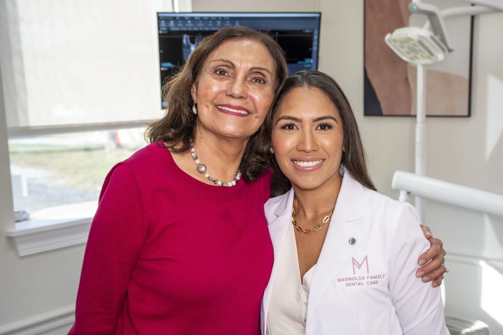 Dr. Rodriguez smiling with a patient after a procedure