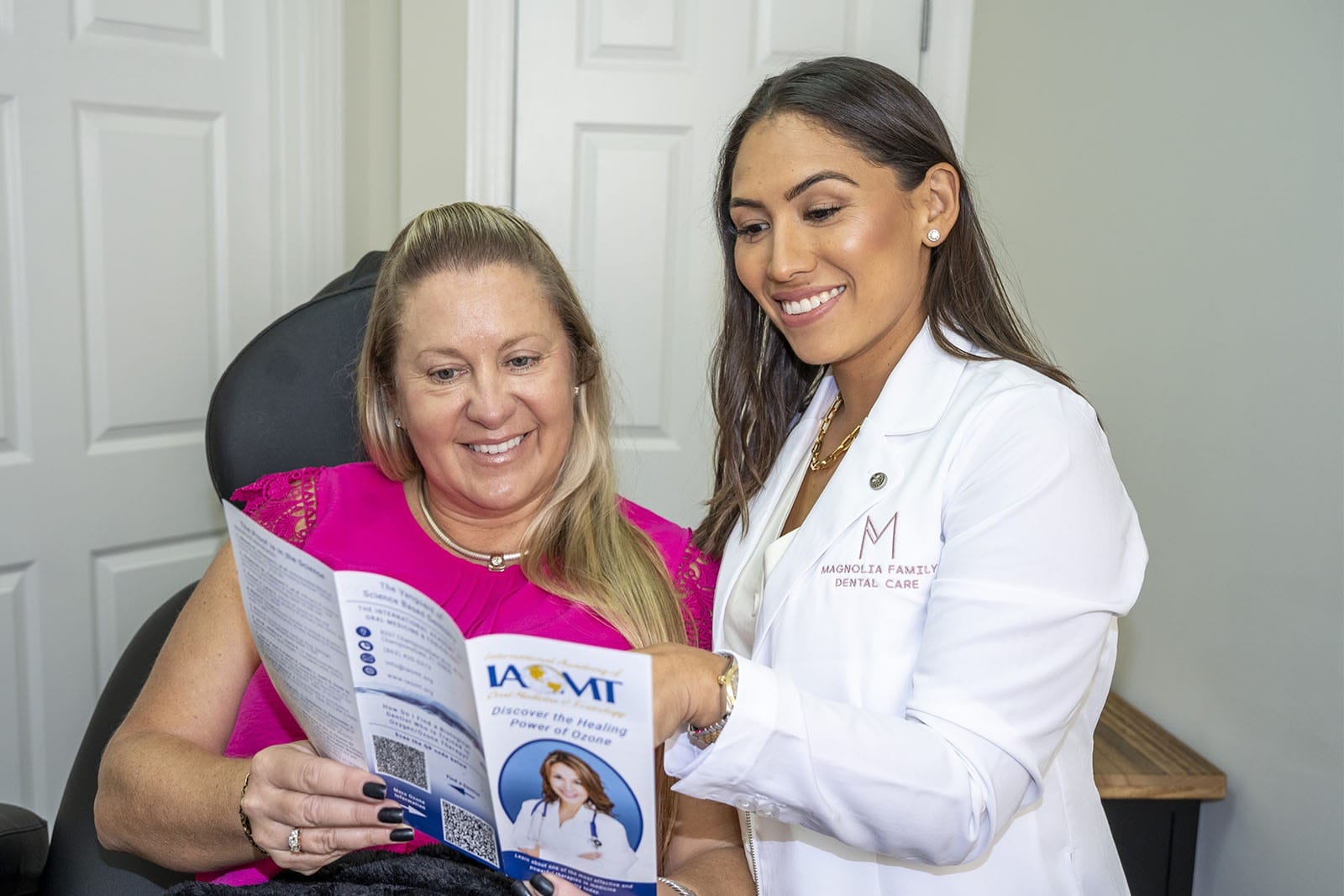 Dr. Rodriguez showing a patient a brochure