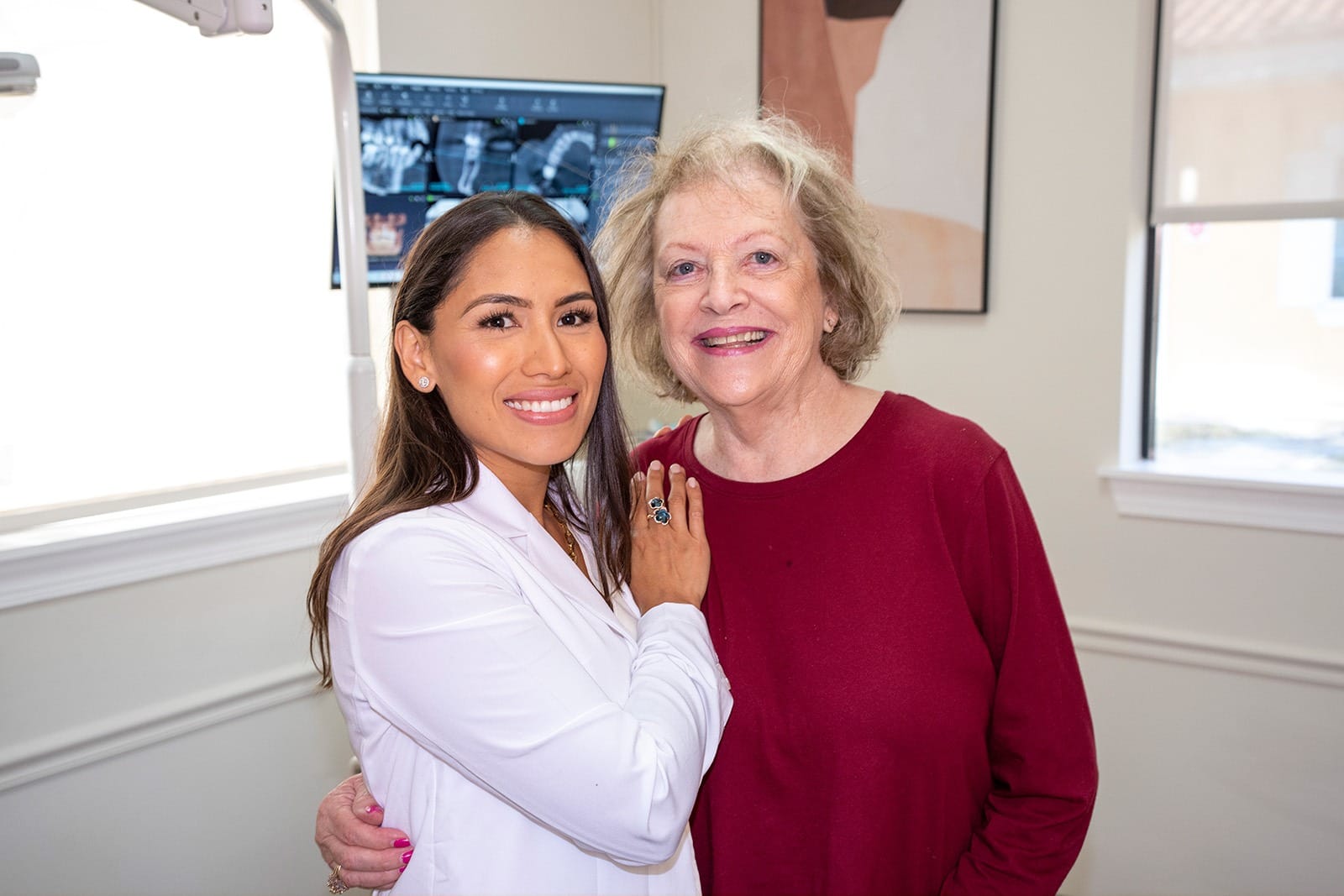 Dr. Rodriguez smiling with a patient after a procedure