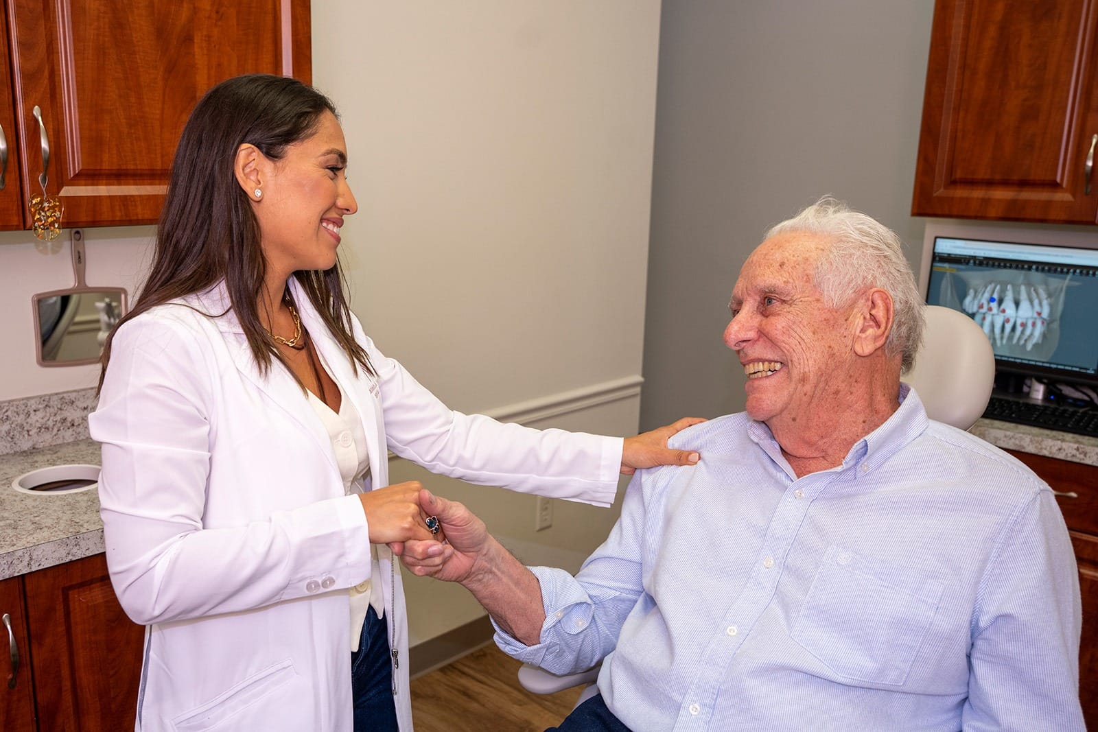 Dr. Rodriguez shakes hands with a patient before a procedure