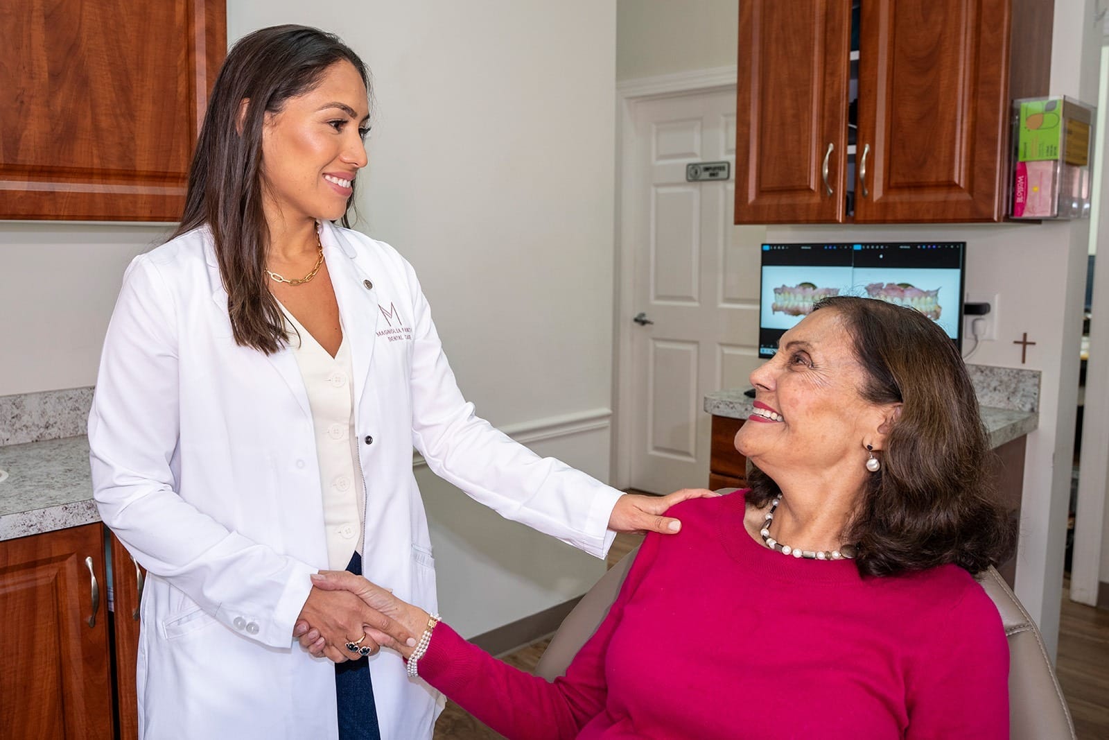 Dr. Rodriguez shaking hands with a patient